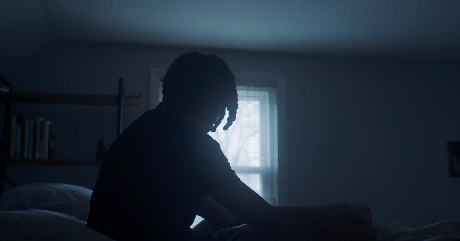 Nicolas Andrew  looking out the window and sitting up on bed in Alone | Nicolas Andrew Visuals